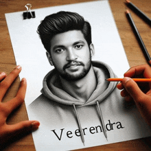 a person is drawing a portrait of veerendra