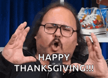 a man with glasses and a mustache is saying happy thanksgiving !!!