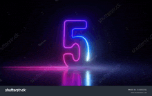 the number five is glowing in the dark with a reflection .