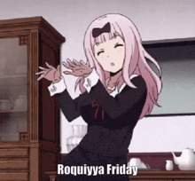 a girl with pink hair is dancing in a kitchen with the words roquiyya friday written on the bottom