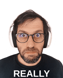 a man wearing glasses and headphones has the word really behind him