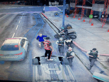 a group of police officers are standing on a street near a sign that says brasilia