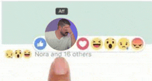 a picture of a man covering his face with his hand and the words " nora and 16 others " below it