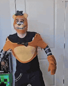 a man in a bear costume is standing in front of a minecraft box .