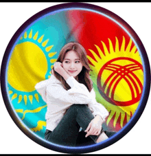 a woman sits in front of a circle with a flag in the background