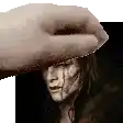 a hand is touching a woman 's face in a black and white photo