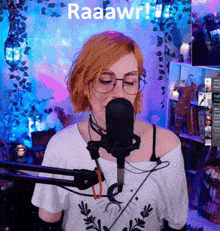 a woman singing into a microphone with the word raaawr written on the bottom