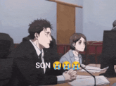 a man and a woman are sitting at a table with the word son written on the bottom