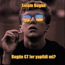 a black and white photo of a man wearing sunglasses with the words selam bugun written above him