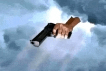 a person is flying through the air with a gun in their hand .