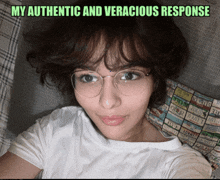 a woman wearing glasses and a white shirt is laying on a couch with the caption " my authentic and veracious response " above her head