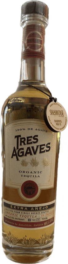 a bottle of tres agaves organic tequila with a tag attached to it