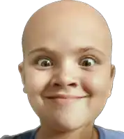 a young girl with a bald head is smiling and making a funny face