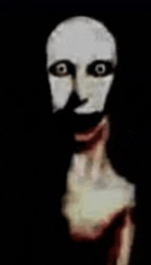 a close up of a scary face with a bloody mouth and a white mask .