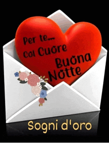 a red heart in a white envelope that says " per te col cuore buona notte "