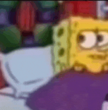 a close up of a cartoon character , spongebob squarepants , laying on a purple blanket .