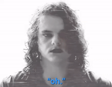 a black and white photo of a man with long hair and the words " oh " on the bottom