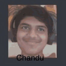 a young man wearing headphones is smiling in a picture with the name chandu .