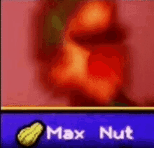 a blurred image of a peanut with the words `` max nut '' written below it .