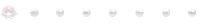 a row of white pearls on a white background