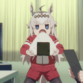 a girl with a crown on her head is holding a triangle of rice