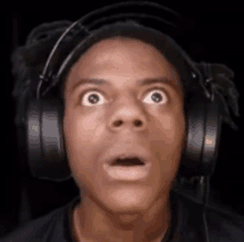 a man wearing headphones with a surprised look on his face