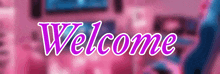 a pink and blue welcome sign with a blurry background