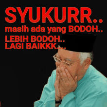 a poster with a man covering his mouth and the words syukurr masih ada yang bodoh lebih bodoh lagi baikkk