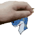 a person 's hand is holding a blue and white dragon 's head .