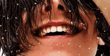 a close up of a woman 's mouth with a lot of hair on it