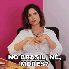 a woman sitting in a chair with the words " no brasil ne mores " on the bottom