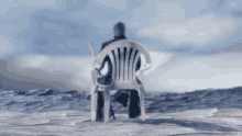 a person is sitting in a white chair with a stick in their hand