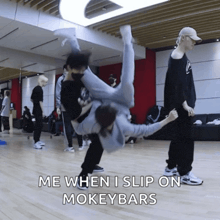 a person is doing a handstand in a dance studio with a caption that says me when i slip on mokeybars