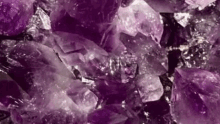 a close up of a pile of purple crystals