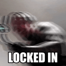 a blurry picture of a person with the words " locked in " on the bottom