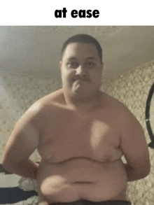 a shirtless man with a very fat belly is standing in a room .