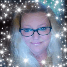 a woman wearing glasses is surrounded by sparkles