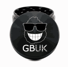 a black grinder with a bearded man wearing sunglasses and the word gbuk on it