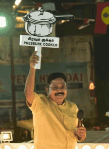 a man holds a sign that says pressure cooker