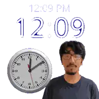 a man wearing glasses stands in front of a clock that reads 12:09 pm