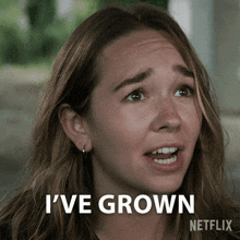 a woman says i 've grown with a netflix logo behind her