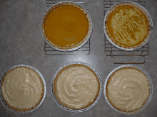 three different types of pies are lined up on a counter