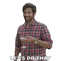 a man in a plaid shirt is holding a glass of wine and saying let 's do that
