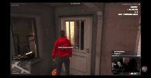 a man in a red camo hoodie stands in front of a door