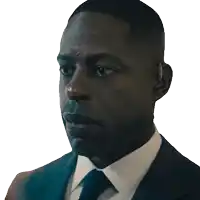 a man in a suit and tie has a earpiece on his ear