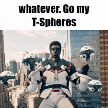 a man in a suit is holding three t-spheres in his hands