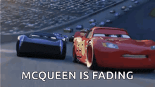 two cars are racing on a race track with the words mcqueen is fading