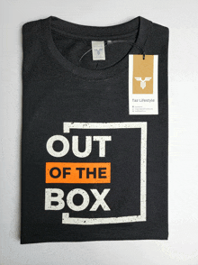 a t-shirt that says out of the box on it