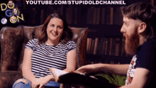 a man and a woman are sitting on a couch with youtube.com/stupidoldchannel written in the corner