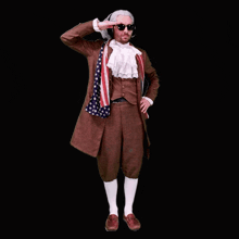 a man dressed as benjamin franklin salutes while wearing sunglasses and an american flag scarf